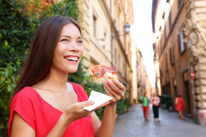 a woman eating a donut