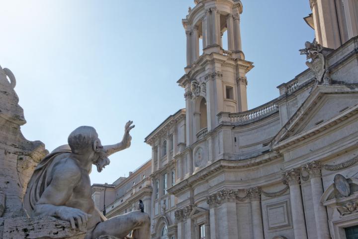 a statue in front of a building